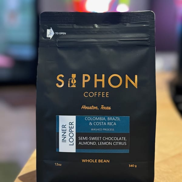 A black bag of Siphon Coffee "Inner Looper" whole beans with flavor notes of chocolate, almond, and citrus.